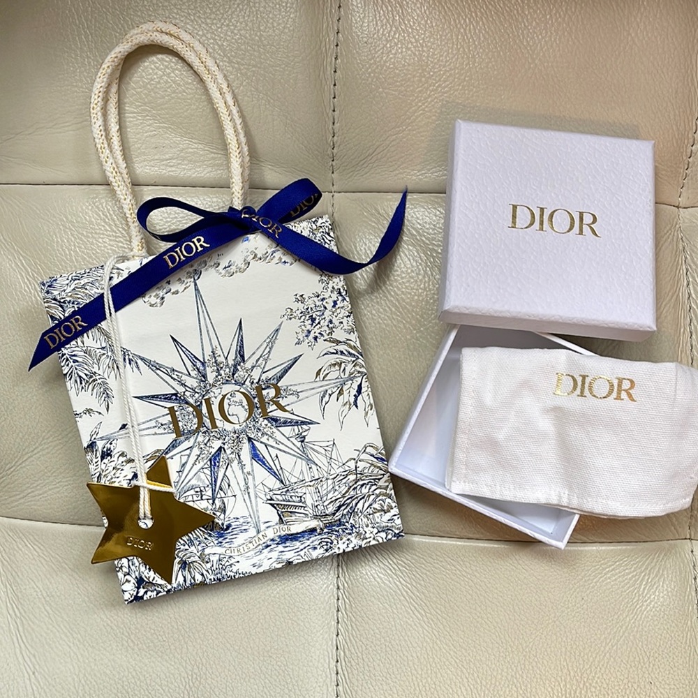 Dior holiday shopping bag with accessory dust bag, box and Dior gold star charm